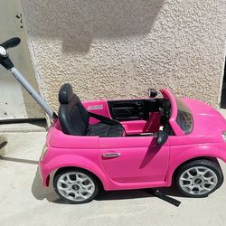 Children push toy car