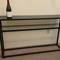 $20, thin side table, behind the couch table
