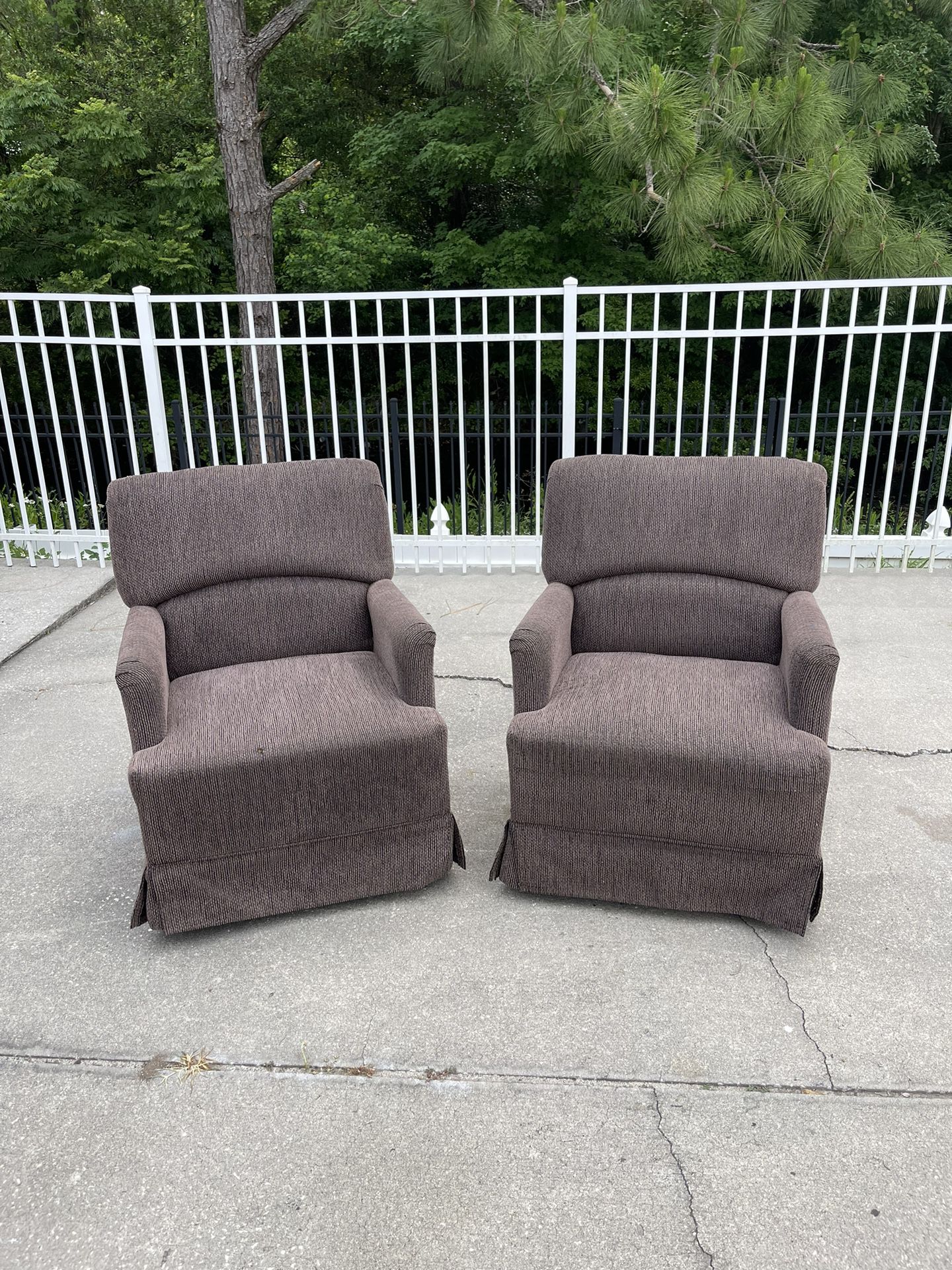 Twin Swivel Brown Chairs
