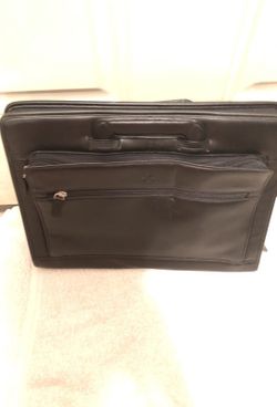 Unbranded but very nice brief case (15 1/4 by 11 1/2 by 2)
