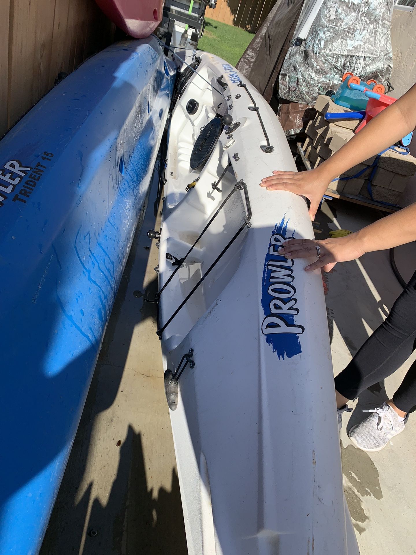 Triton Ocean fishing kayak with seat paddles and bait tank