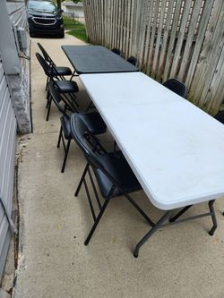 Two Folding Tables and Eight Chairs