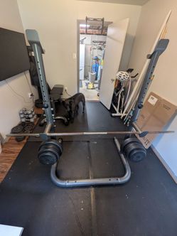 Squat rack + Barbell + Plates