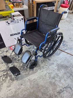 New Drive Medical Blue Streak Foldable Wheelchair, Leg Rests, 18" Seat
Durable Construction, Desk Arms and Elevating Leg Rests for Easy Mobility