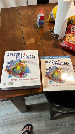 Anatomy & Physiology book with atlas