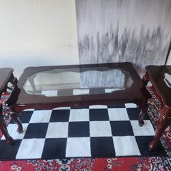 Wooden Coffee table with 2 matching side tables. Glass top on all 3 tables.