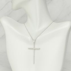silver cross pendant necklace adorned with delicate pavé cubic zirconia stones for a refined sparkle. 
