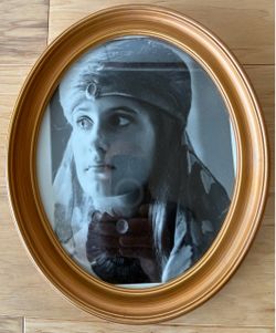 Oval gold frame, 10”X12”.