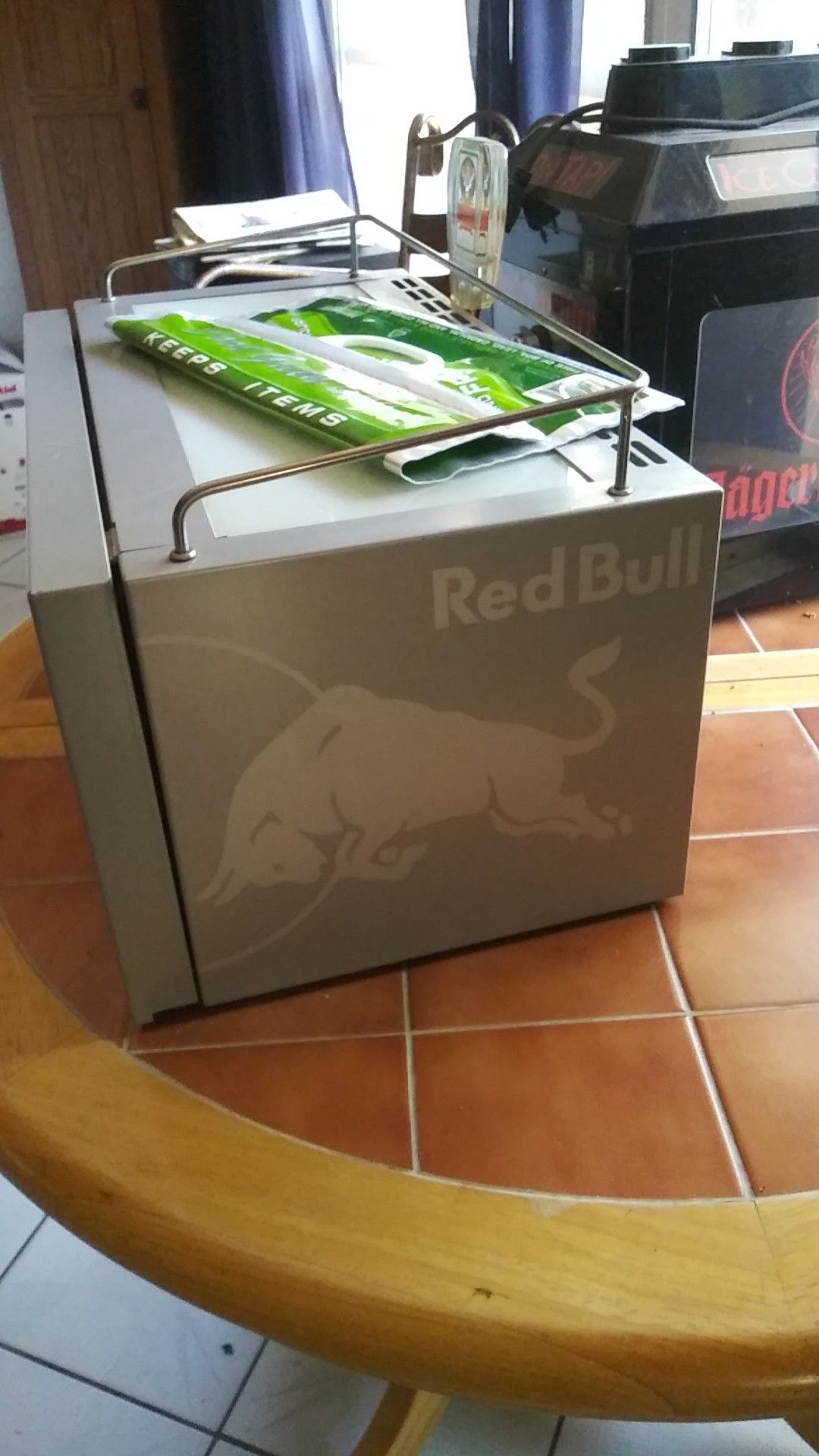 Red bull lighted bar cooler and jaeger meister on tap. Both working refridgerated and lit