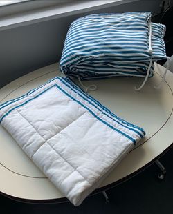 Baby sling, crib set and toddler bed rail