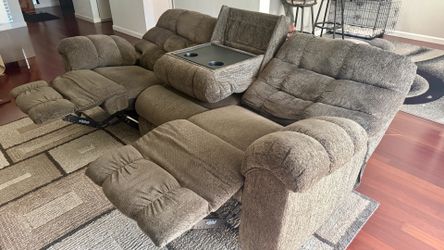 Reclining brawn sofa with center console