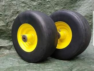Pair of 11/4.00-5 Semi-pneumatic Smooth front lawnmower tire mounted on JD Yellow wheel
