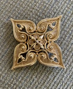 Coro gold brooch. 3”