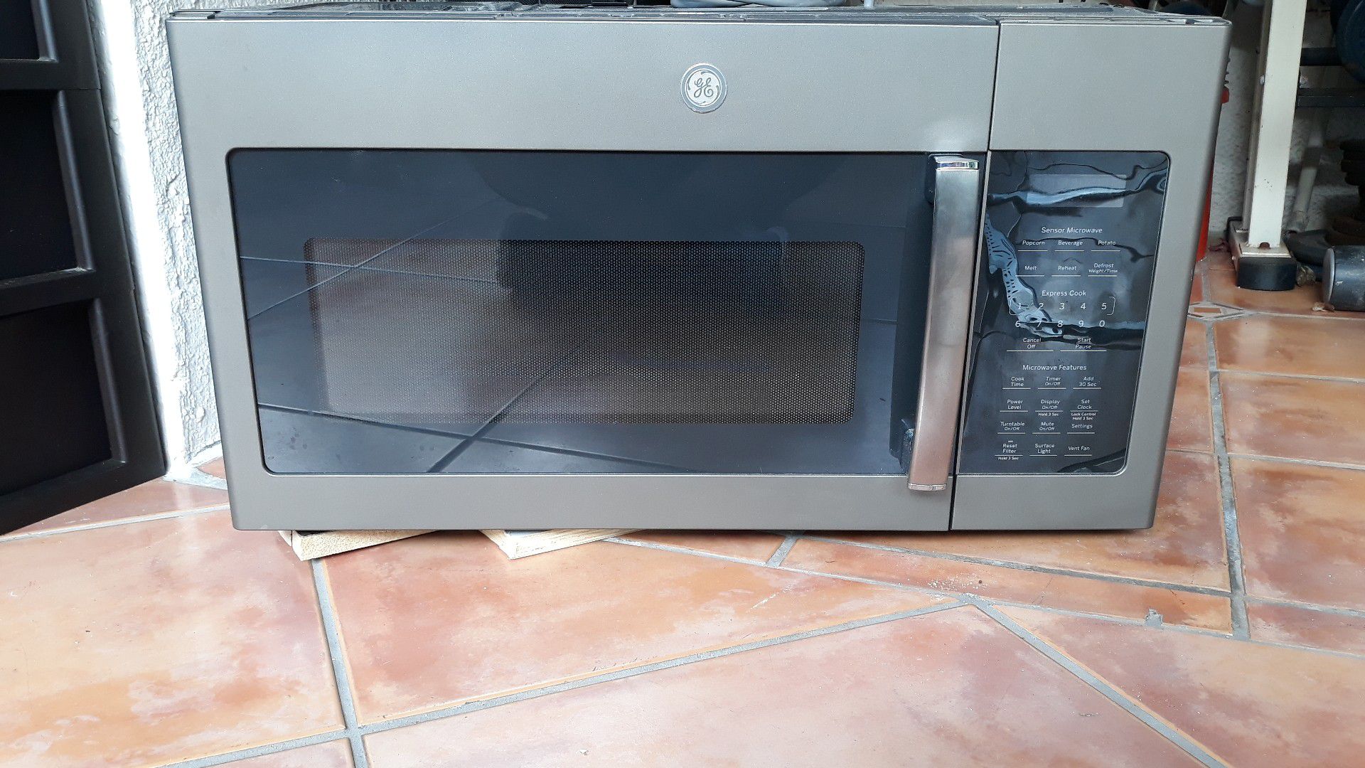 GE 1.7 cu ft Over The Range Microwave