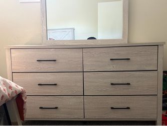 Dresser with mirror attached