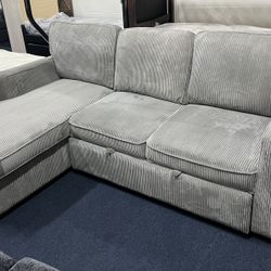 Light Grey Reversible Sectional Sleeper W/ Storage