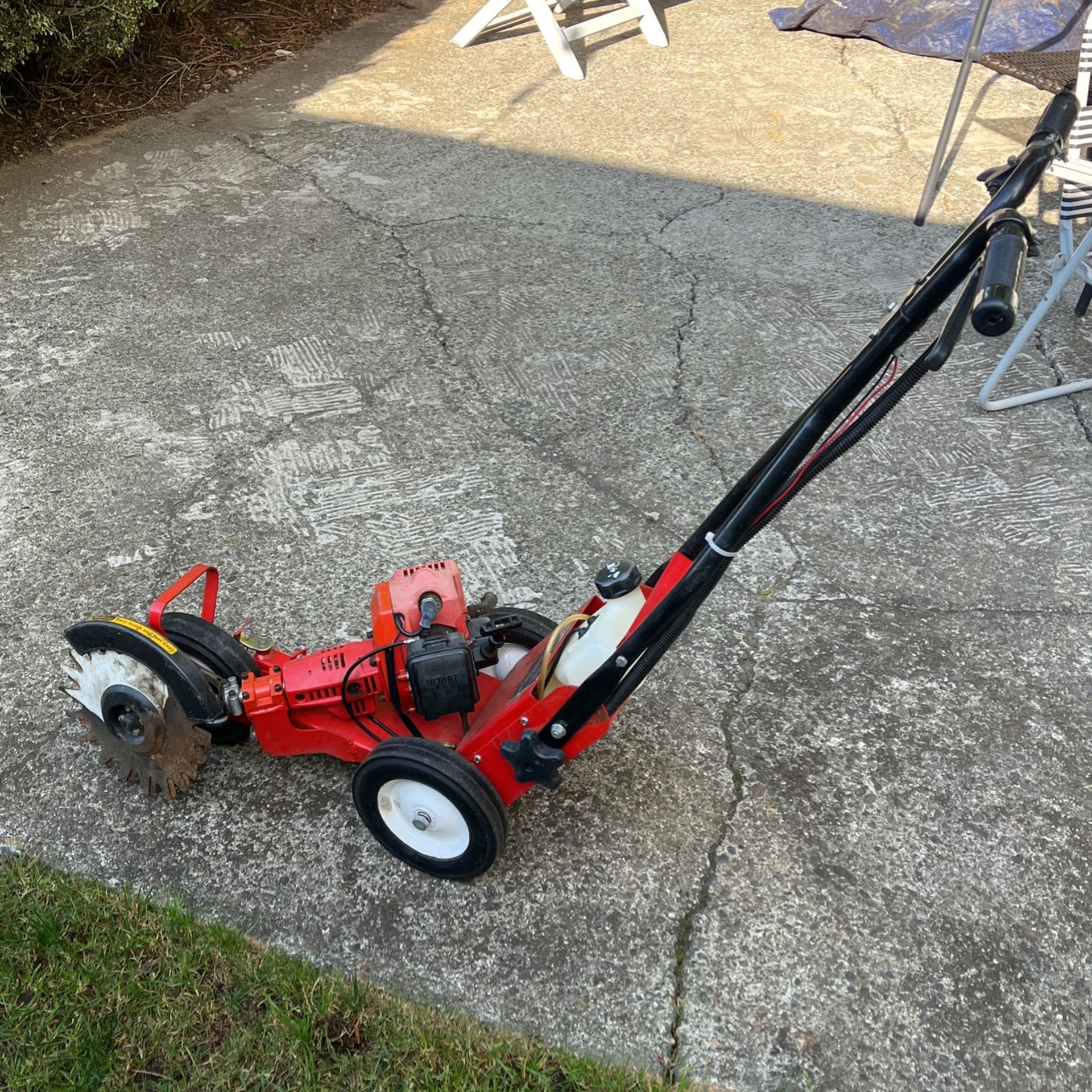 Red max commercial reciprocating edger
