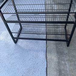 (4) Tiers Metal Shelf  Can Be used For Folded TShirts Shoes Etc Or In The Kitchen Or Laundry Room . 