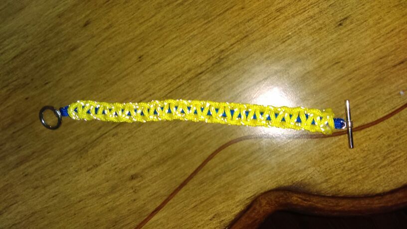 Yellow and blue survival paracord bracelet with metal clasp