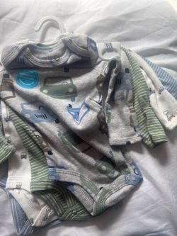 Carter’s new 4 pack of Newborn long sleeve bodysuits.