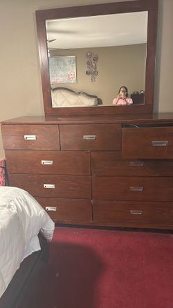 All wood  nine drawer dresser with rollers
