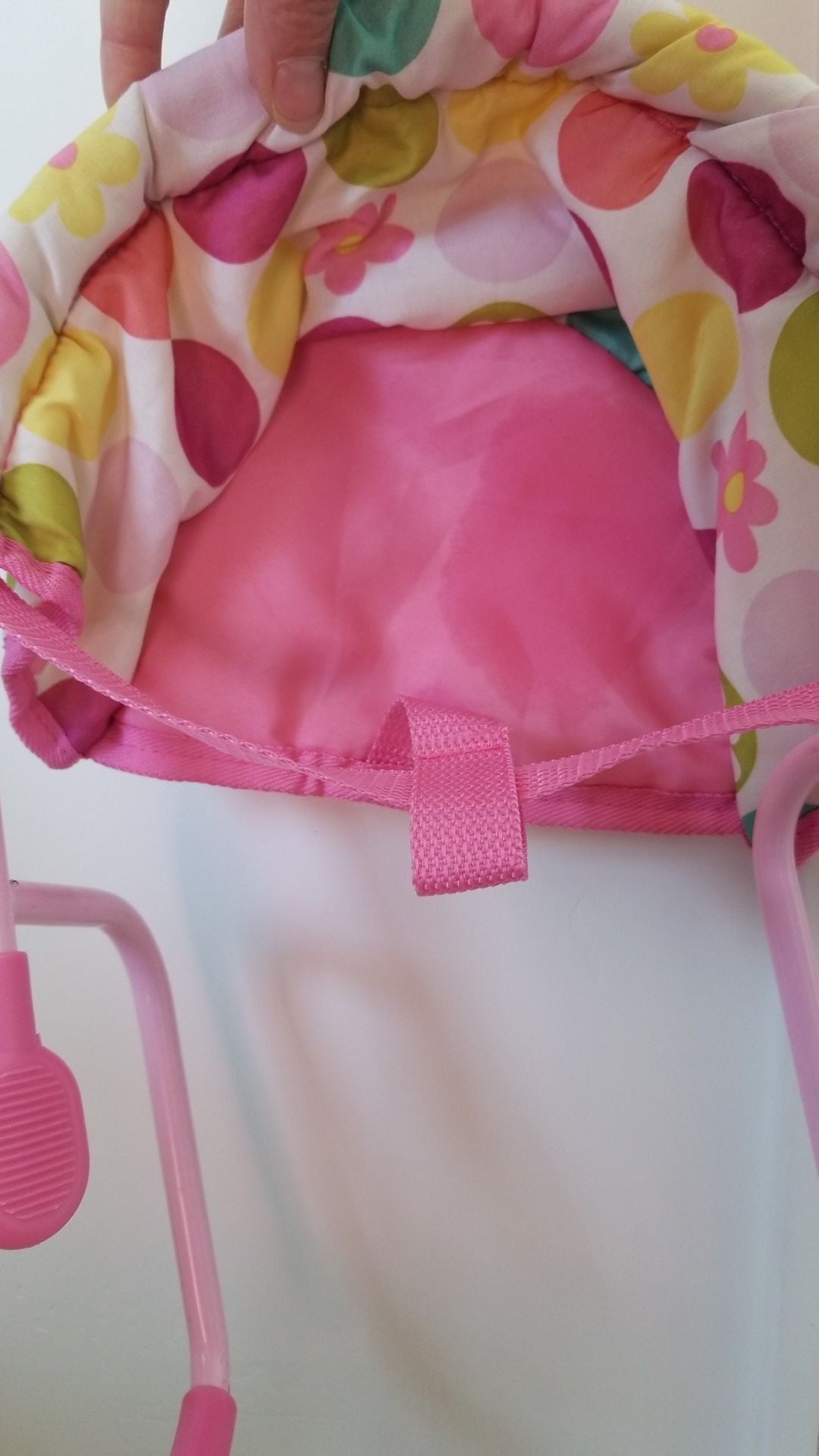 A baby doll high chair for a table