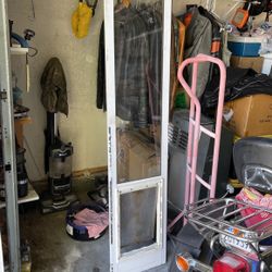 Dodgy Door For Medium Size Dog  78”h 15”w.  Dog Door Is 10”w 16” H Asking For $50 Obo