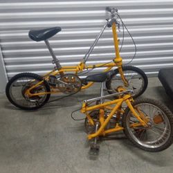2 Matching Yellow Vintage Folding Bikes