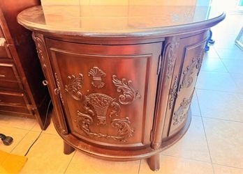Dark Wood Demilune Cabinet with Carved Detail