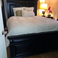 Black queen size bed and bureau with mirror