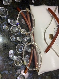 Millionaire Celebrity Glasses “Look Like Money” One (1) Unisex wooden frame with sparkling lab, diamond ice trim. Comes with a white protective case f