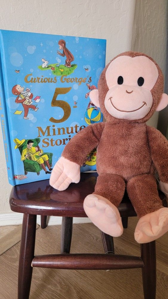 Curious George storybook and stuffed animal