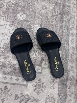 Black Chanel slides