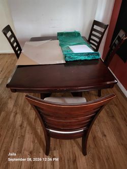 Wooden table with four chairs