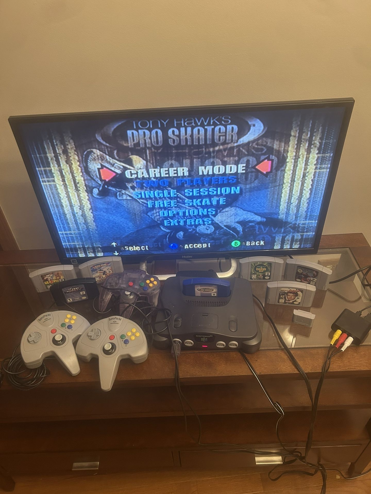 N64 Bundle Nintendo 64 Console, 32” TV, 7 Games, 3 Controllers, 1 Controller Pak, & RCA to HDMI Adapter