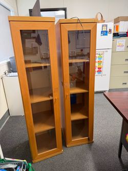 Twin glass tower cabinets