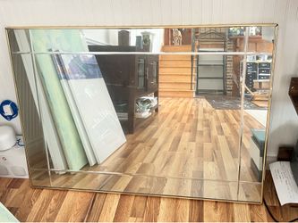 Large gold framed rectangular wall mirror