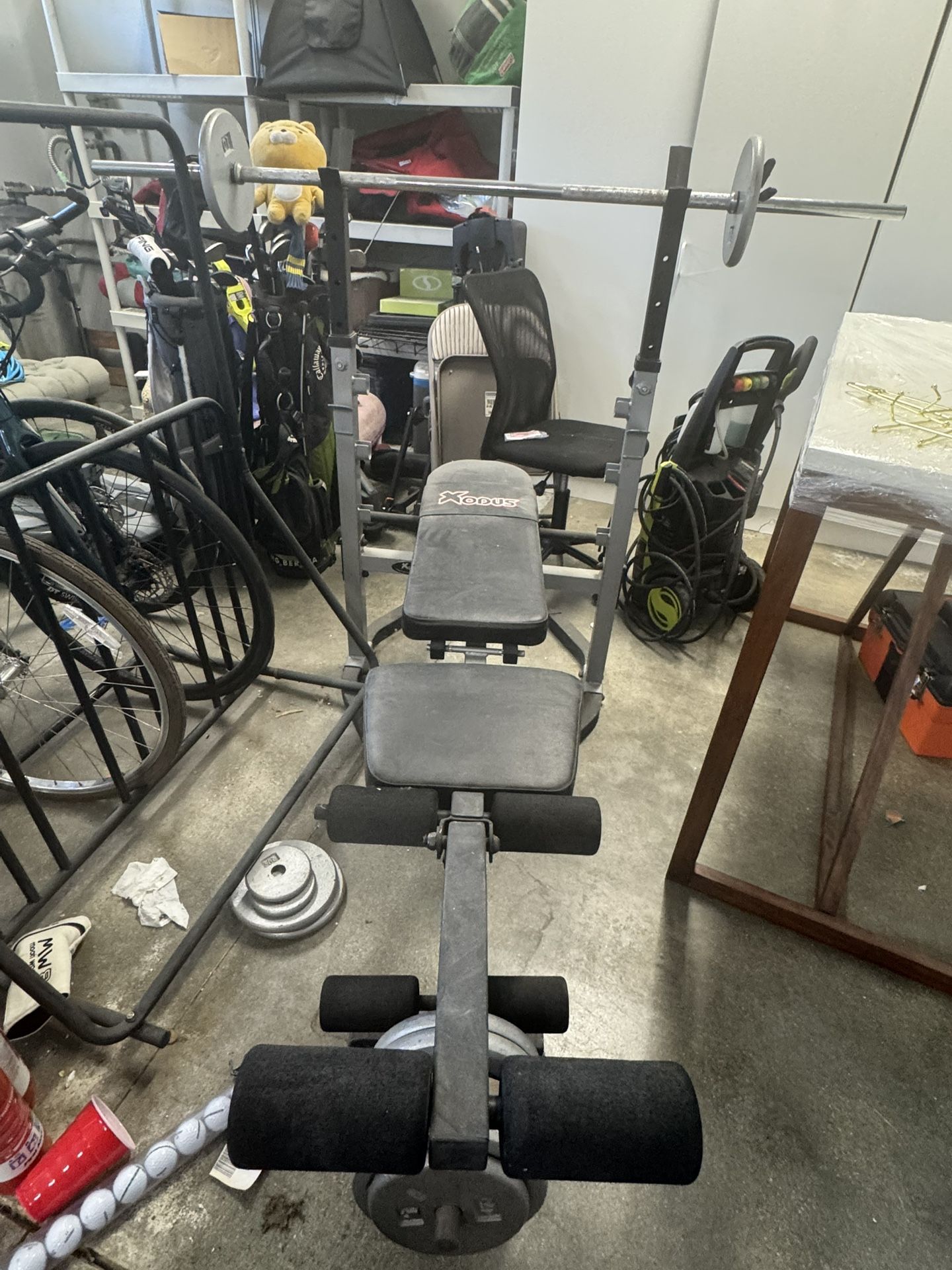 Weight Bench With A Bar and Weights