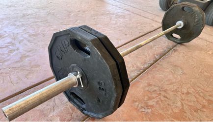 Olympic Bar and  four 45 lbs plates