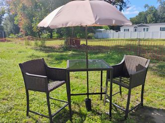Two-seater barstool height patio set with umbrella $60 will be available