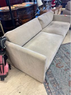 light-colored, low-profile sofa - 74”