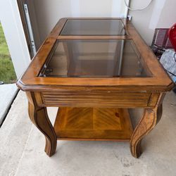 Wooden coffee table with a glass top