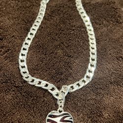 Zebra Heart Charm Necklace – A stylish 18” necklace featuring a unique zebra heart charm, perfect for adding a touch of elegance to any outfit.