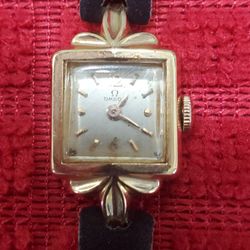 18K GOLD OMEGA WOMENS WATCH 