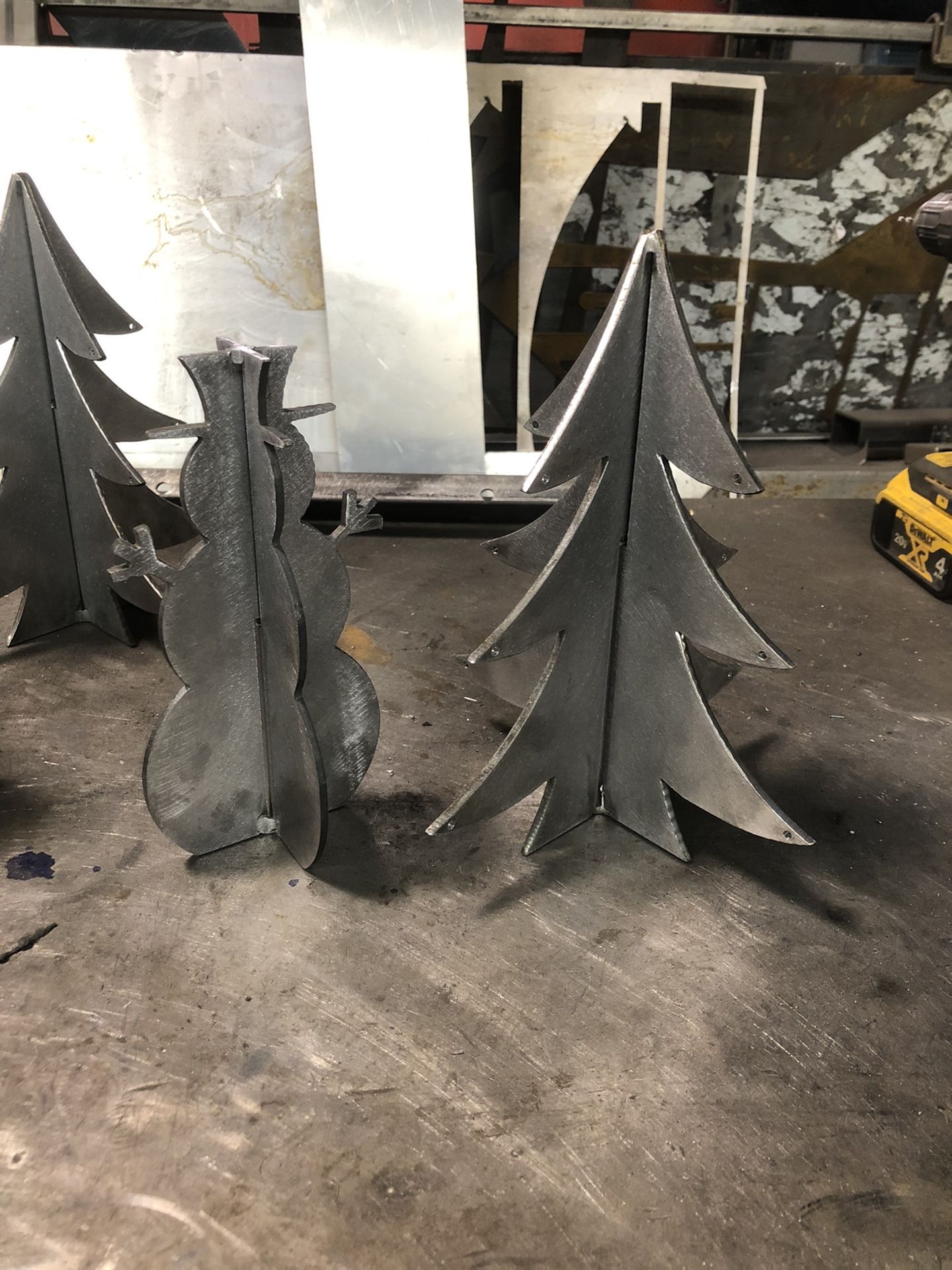 Steel Snowmen And XMas Treess