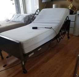 Adjustable Electric bed with rails excellent condition