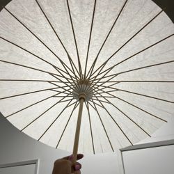 White parasol umbrella