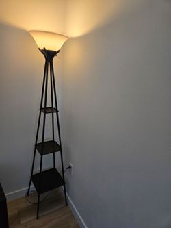 Black floor lamp with built in shelves