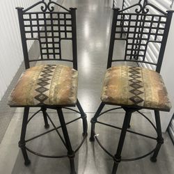 2 solid rustic looking upholstered swivel chairs/bar stool in great condition. Located below  31705 SR-54  Wesley Chapel, FL  33545 Metro Self Storage