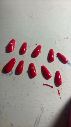 Bright red cute nails with two 3-D charms